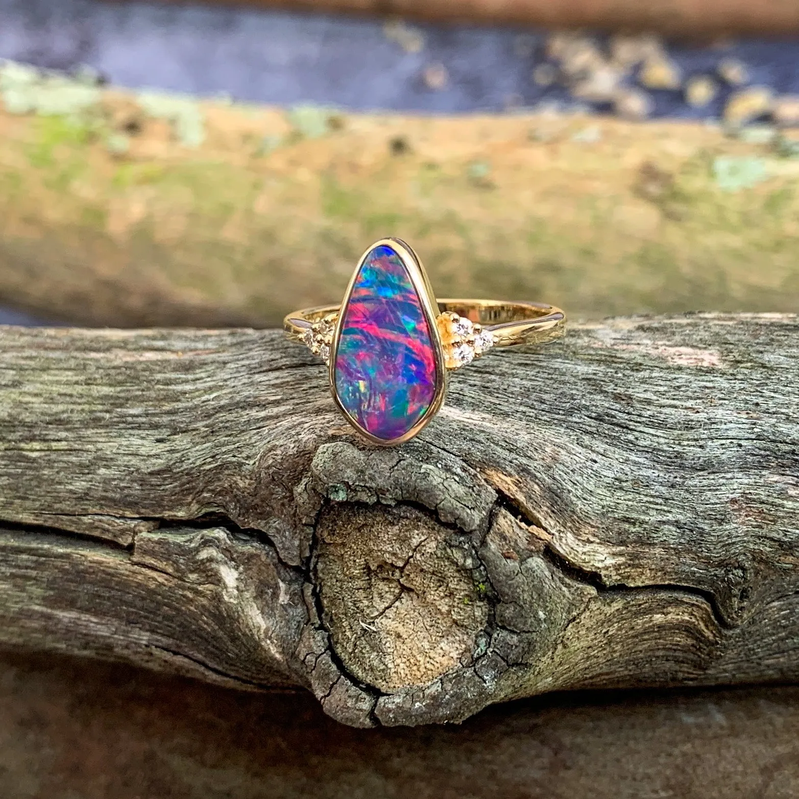 14kt Yellow Gold Opal doublet red flash with diamonds ring
